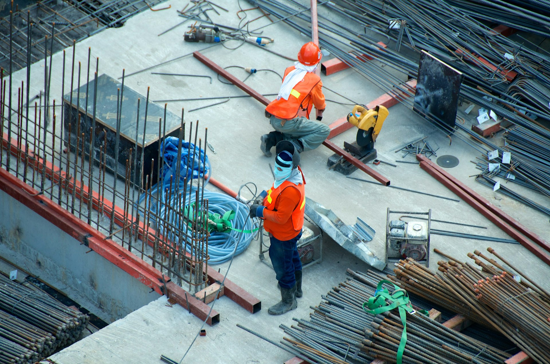 Aerial view of a construction crew on a commercial concrete deck