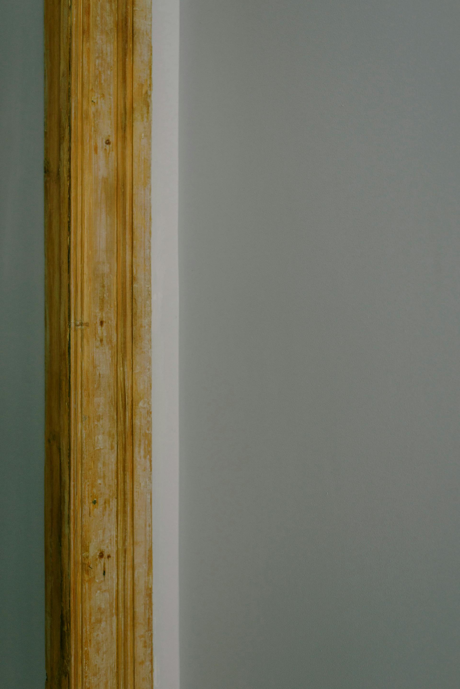 Interior wall corner with exposed wood trim